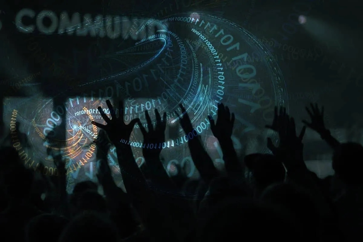 Silhouettes of raised hands in a crowd overlaid with swirling binary code and the word 'COMMUNITY' in the background, suggesting a blend of technology and human connection.